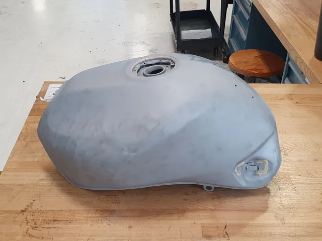 The same fuel tank stripped, filled and primed grey, ready for paint.